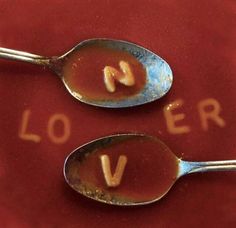 two spoons with the word love spelled on them