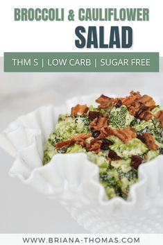 broccoli and cauliflower salad in a white bowl with text overlay