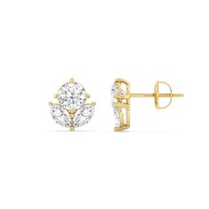 two stone stud earrings in yellow gold with diamonds on each side and an oval cut diamond center