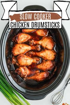 slow cooker chicken drumsticks in a crock pot with green onions on the side