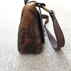 "Beautiful Vintage 60s or 70s Saddle Leather Handbag Purse Great Vintage Condition with Amazing Patina - unique hardware, and leather stitching, inside leather pocket Rough Measurements: Width: 10 1/2\" Length (the bag itself not including strap or ring handles): 9\" Depth (slightly Stretched): 4\" Will ship out between 1-3 business days once the payment has been made. Please message me w/ any questions. All sales final. And please check out my other vintage shirts!! thank you!" Brown Saddle Shoulder Bag With Brass Hardware, Retro Leather Flap Bag For Daily Use, Vintage Brown Leather Saddle Bag With Leather Lining, Vintage Brown Leather Shoulder Bag With Brass Hardware, Leather Saddle Bag With Brass Hardware For Daily Use, Retro Brown Saddle Bag Satchel, Brown Saddle Bag With Brass Hardware, Retro Brown Saddle Satchel Bag, Vintage Brown Leather Crossbody Saddle Bag