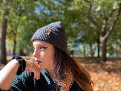 Give the gift of warmth and style! This knit beanie is perfect for hiking, camping, and perfect for keeping warm! Beanie is a dark charcoal gray color, and is made of a soft wool/acrylic blend. Attached is an engraved leather label tag with a brass rivet. The leather label is engraved on both sides, so whether you wear the hat with the brim up or down, the label will still show the design in the correct orientation. Choice of circle logo or trees available at checkout. Care - Hand wash, dry flat Warm Beanie For Outdoor, Outdoor Beanie Cap, One Size Fits Most, Gray Beanie For Winter, Winter Hiking Cap, Warm Hats For Winter Outdoor Activities, Winter Knitted Hat For Outdoor Activities, Knitted Winter Hat For Outdoor Activities, Knitted Hats For Winter Outdoor Activities, Warm Winter Hat For Outdoor Activities