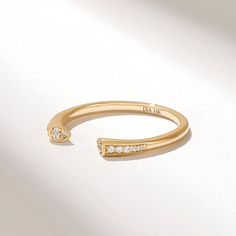 The Diamond Cuff Ring is a captivating and contemporary piece of jewelry designed for women who appreciate open and innovative designs. Crafted in your choice of 14k, 18k, or 10k Solid Gold, this ring features an open and airy design with a wrap-around cuff adorned with pave diamonds. Features * Made to Order. * Gold KT: 10K, 14K, 18K * Custom Gold Color: Rose Gold, Yellow Gold, White Gold * Diamond Color- Clarity: G color SI clarity (excellent ideal cut) * Total Ctw: 0.07 ctw * Width of Band: 2.75 MM * Thickness of Band: 1.75MM * Ready to Ship in 5-7 Business Days ✓ We care about the environment,the jewelry we cast is made with recycled gold. We source exclusively post-consumer material that is refined back to their pure elements to ensure that the gold is in the same quality. Our designs Open Ring Design, Open Wedding Band, Diamond Cuff Ring, Diamond Wrap Ring, Open Cuff Ring, Wedding Band Women, Gold Rings Stackable, Diamond Stacking Rings, Cuff Ring