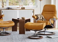 an image of living room setting with chairs and ottomans in yellow leather color scheme