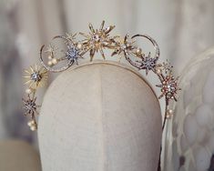 a headpiece with pearls and stars on it