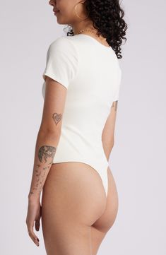 Create chic tucked-in looks with this seamless, T-shirt–style bodysuit made from buttery-soft, subtly lustrous rib. Jewel neck Short sleeves Lined, except sleeves 94% nylon, 6% spandex Machine wash, line dry Imported Trendy Solid Color Short Sleeve Bodysuit, Chic Fitted Seamless Bodysuit, Fitted Short Sleeve Bodysuit With Scoop Neck For Spring, Spring Short Sleeve Scoop Neck Bodysuit, White Smoothing Bodysuit For Summer, Trendy High Stretch Short Sleeve Bodysuit, White Scoop Neck Elastane Bodysuit, Sleek High Stretch Bodysuit For Spring, Trendy High-stretch Short Sleeve Bodysuit