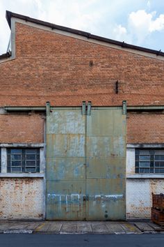 an old brick building with two large doors