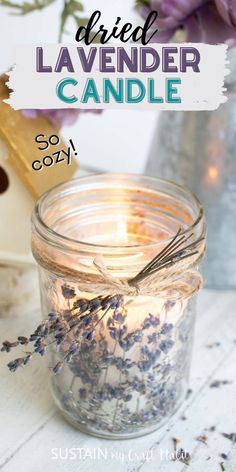 a jar filled with lavender candles sitting on top of a table