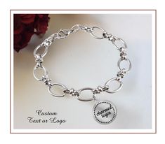 ♥ Stainless Steel Chain Link Bracelet featuring your TEXT, INITIALS, LOGO or GRAPHIC (including handwriting) - 60mm Stainless Steel Bracelet * 20mm Stainless Steel Charm * Charm can be engraved on one or both sides * For example, logo/graphic on one side, and text on the 2nd side ♥ HOW TO ORDER TEXT CHARMS: * In the Personalization box, enter your text * Use caps, spelling & punctuation exactly as you want it to appear ♥ HOW TO ORDER LOGO CHARMS: * In the Personalization box, enter the word "graphic" * After checking out, email a pic of your logo/graphic to: charmedlogos [!at] gmail.com ♥ ADD a BIRTHSTONE here:  www.etsy.com/listing/1709393839 How To Order Logo, Personalized Silver Bracelets, Initials Logo, Punctuation, Logo Graphic, Steel Chain, Steel Bracelet, Stainless Steel Chain, Chain Link Bracelet