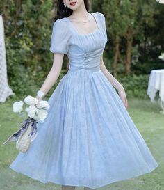 Slip into this truly exquisite 1950s vintage reproduction Edith pale sky blue dress and feel like the belle of the ball. Crafted with meticulous attention to detail, this light and airy piece with ruched details, accented waist, and voluminous skirt is sure to captivate. Perfect for any special occasions, it will lend a touch of timeless elegance to your vintage style wardrobe. Dress Biru, Blue Vintage Dress, Vintage Dress Blue, Sky Blue Dress, Baby Blue Dresses, Light Blue Dresses, Korean Dress, Vintage Style Dresses, Fairy Dress