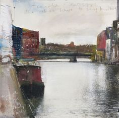 a painting of a river with buildings in the background and writing on the wall above it