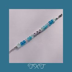 a blue and white beaded bracelet with the word fix on it's side