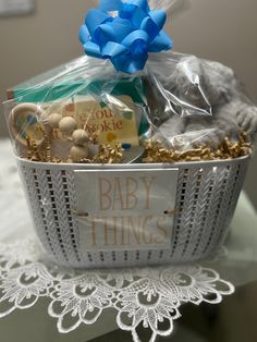 a basket filled with baby things sitting on top of a table