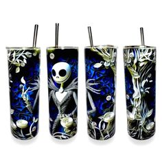 three different types of lighters decorated with skulls and flowers on blue glass, one has a skeleton in the middle