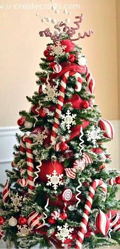 a christmas tree decorated with candy canes and ornaments