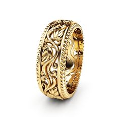 a gold ring with intricate designs on the sides and an intricate design on the inside