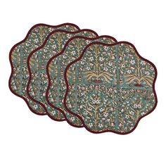 three placemats with floral designs on them