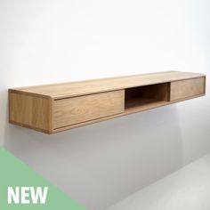 a wooden shelf mounted on the wall