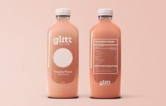 two bottles of glitt on a pink background