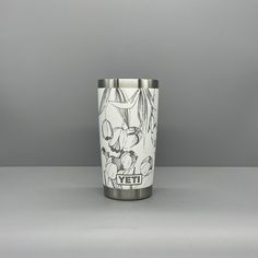 the yeti cup is designed with an image of mickey mouse and pluto on it