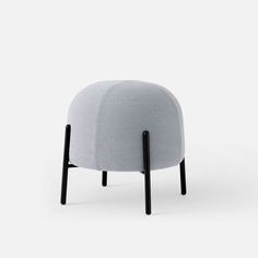 a grey chair with black legs on a white background and the seat is upholstered