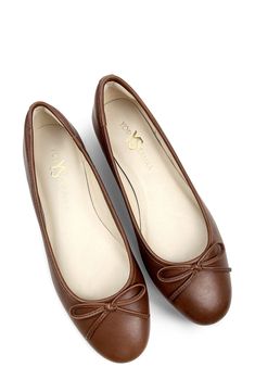 Signature logo hardware and a delicate vamp bow lend luxe elements to a timeless ballet flat set on a cushioned footbed for lasting comfort. Memory foam cushioning with arch support Slip-resistant sole Leather upper and lining/rubber sole Imported Elegant Brown Flats With Bow, Elegant Brown Ballet Flats With Round Toe, Elegant Brown Round Toe Ballet Flats, Elegant Brown Ballet Flats With Removable Insole, Elegant Slip-on Ballet Flats With Arch Support, Elegant Ballet Flats With Arch Support, Elegant Ballet Flats With Cushioned Footbed And Round Toe, Elegant Cushioned Closed Toe Ballet Flats, Elegant Ballet Flats With Cushioned Footbed And Low Heel