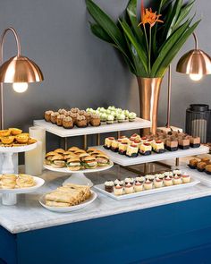 an assortment of desserts and pastries on a table