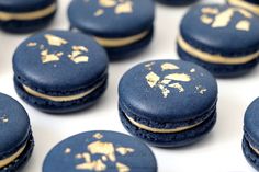 blue macaroons with gold leaf designs on them