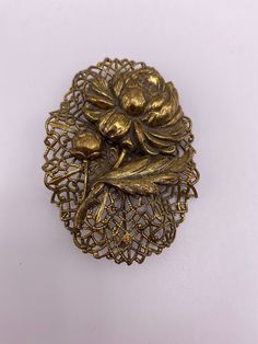 Lovely 1930's brass filigree floral design brooch. Approximately 2"x3" in great condition. Vintage Brass Brooches For Formal Occasions, Vintage Filigree Brooches, Vintage Brass Brooch For Formal Occasions, Vintage Gold Brooches With Intricate Design, Vintage Brass Wedding Brooches, Vintage Gold Brooch With Intricate Design, Antique Gold Brass Brooches, Vintage Brass Formal Brooches, Gold Filigree Brooches Collectible