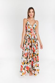 Immerse yourself in bohemian elegance with our floral print V-neck, long sleeveless dress. This chic and stylish ensemble features adjustable straps, allowing you to customize your fit. Embrace the perfect blend of comfort and fashion with this thoughtfully designed dress, destined to elevate your wardrobe and make a statement with its timeless and graceful appeal. Summer Floral Dress With Adjustable Straps For Beach, Bohemian Maxi Dress With Adjustable Straps For Brunch, Flowy Floral Print Maxi Dress With Spaghetti Straps, Flowy Maxi Dress With Spaghetti Straps And Floral Print, V-neck Sundress For Garden Party, V-neck Dresses With Adjustable Straps For Vacation, V-neck Floral Sundress For Garden Party, V-neck Floral Sundress For Brunch, Flowy Spaghetti Strap Floral Maxi Dress