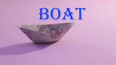 an origami boat with the word boat on it