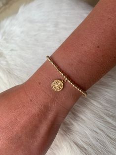 "This 14k gold filled bead bracelet is a perfect addition to a dainty stack. It is made of 3 mm 14K gold filled beads and is adorned with a 14K gold filled St. Benedict charm. The charm measures 11mm in diameter. For best fit, measure your wrist at the wrist bone with a measuring tape or string. Add 1/2\" to that measurement for a snug fit, 3/4\" - 1\" for a comfort fit, or 1\" or larger for a loose fit. Your bracelet will arrive in a gift box. Deluxe gift wrap is available at checkout. Listing Dainty Yellow Gold Beaded Bracelets In 14k Gold Filled, 14k Gold-filled Yellow Gold Beaded Bracelets, Minimalist Hand-strung Beaded Bracelets In 14k Gold Filled, Minimalist Hand-strung 14k Gold Filled Beaded Bracelets, Beaded 14k Gold Filled Yellow Gold Bracelets, Everyday 14k Gold Filled Beaded Bracelets With Tiny Beads, Rose Gold Beaded Bracelets With 14k Gold Filled, Dainty Gold Beaded Bracelets With Tiny Beads, 14k Rose Gold Filled Beaded Bracelets