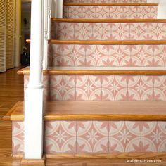 the stairs are decorated with pink and white tiles