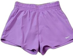 Nike Shorts With Pockets In Solid Color, Stretch Shorts For Playwear, Stretch Playwear Shorts, Stretch Playwear Shorts In Solid Color, Nike Shorts For Summer Playwear, Nike Summer Shorts For Playwear, Casual Purple Playwear Bottoms, Casual Purple Bottoms For Playwear, Nike Bottoms For Playwear In Short Style