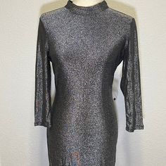 Never Worn. Still Have Tag With Extra Button On It. Sexy Bodycon Dark Silver Mock Neck Dress With Long Sleeves And Open Back. Great For A Party Or Night Out. Button Closure In Back Size Medium Long Sleeve Party Mock Neck Open Back Metallic Shiny Glitter Sparkle Sparkly Club Rave Y2k Stretch Sexy Metallic Long Sleeve Mini Dress For Fall, Metallic Long Sleeve Mini Dress With Sequins, Metallic Long Sleeve Sequin Mini Dress, Metallic Long Sleeve Shiny Dress, Metallic Shiny Long Sleeve Dresses, Fitted Long Sleeve Mini Dress With Shimmer, Fitted Long Sleeve Shimmer Mini Dress, Long Sleeve Fitted Shimmer Mini Dress, Gray Bodycon Dress For Party