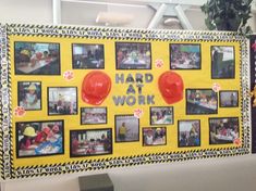 a bulletin board with pictures on it that says hard at work and balloons in the middle