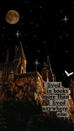 an image of hogwart's castle at night with the quote lived in books more than one who lived anywhere else