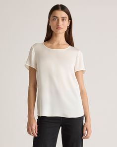 We love to luxe up an everyday look. This classic tee is made from washable silk, with a bit of stretch for the perfect fit. The crew neck and tulip hem gives it a little curvature for a more premium look. The washable silk makes this top super easy to care for. Plus, silk fiber contains 18 kinds of amino acids that make it amazing for skin nourishment, hypo-allergenic, and naturally thermoregulating to help maintain body temperature.  | Quince | Women's 100% Washable Silk Stretch T-Shirt in Ivo Elegant Spring T-shirt For Everyday, Relaxed Fit Everyday T-shirt, Elegant Spring T-shirt, Elegant Summer Top For Everyday, Elegant Short Sleeve Shirt For Everyday, Elegant Tops With Relaxed Fit And Shirttail Hem, Elegant Crew Neck Top With Relaxed Fit, Elegant White T-shirt For Everyday, Elegant Relaxed Fit Crew Neck Top