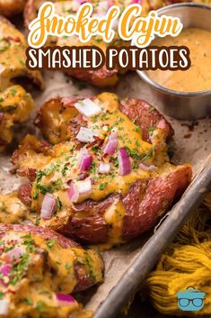 the baked potatoes are covered in cheese and garnished with red onions