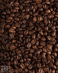 a pile of coffee beans is shown in this image