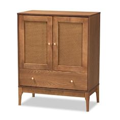 a wooden cabinet with wicker doors on the top and bottom drawers, against a white background