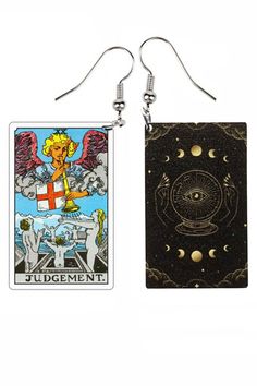 two taroti cards are hanging from earrings