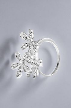 This beautiful sparkling ring features three pretty flowers and will add a touch of feminine glamor to any casual or formal outfit. A timeless piece and the perfect gift for someone you love; Crafted with quality materials like Rhodium and embellished with high quality Crystals means that this Ring is a winner wherever you decide to wear it! | This carefully crafted Ring is Rhodium plated which enhances its eye catching design. Integral to the Ring are the stunning Crystals that truly brings it Flower Shaped Crystal Wedding Ring, Silver Flower Ring For Party, Silver Flower Shaped Rings For Party, Silver Flower Shaped Party Rings, Silver Crystal Ring For Wedding With Flower Shape, Silver Flower Crystal Ring For Anniversary, Silver Crystal Ring With Flower Shape For Wedding, Silver Floral Crystal Wedding Ring, Silver Flower Crystal Ring For Wedding