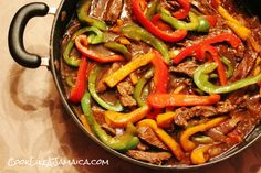 a skillet filled with beef and peppers