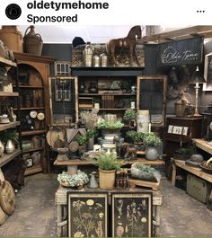 an old fashioned store filled with lots of furniture and pots on top of shelves next to each other