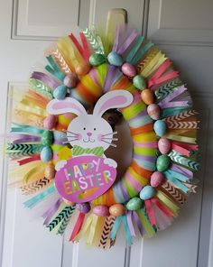 a colorful wreath with an easter bunny on it