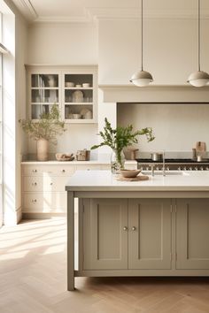 a kitchen with an island, stove and cabinets in it's center area is shown