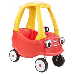 a little red car with wheels and eyes on it's face, sitting in front of a white background