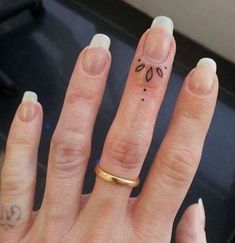 a person's hand with a tattoo on it and the words pretty finger tattoo design