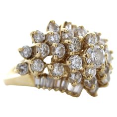 an antique diamond cluster ring in yellow gold